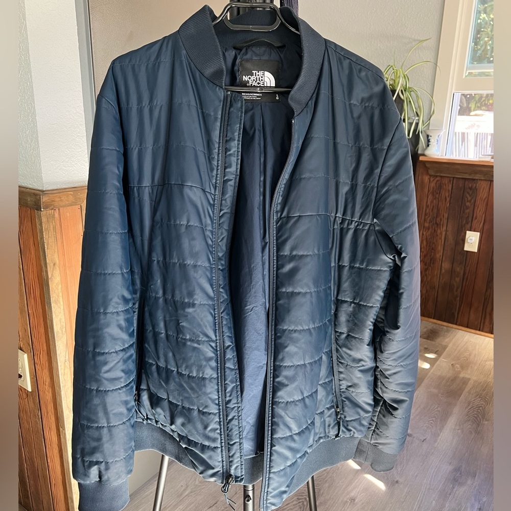 Blue north face bomber jacket